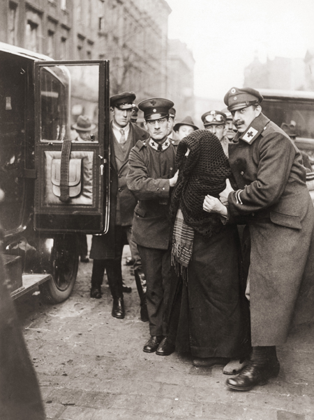 Red Cross Workers Escort an Elderly Voter to the Polls during the Referendum in Upper Silesia (March 20, 1921)